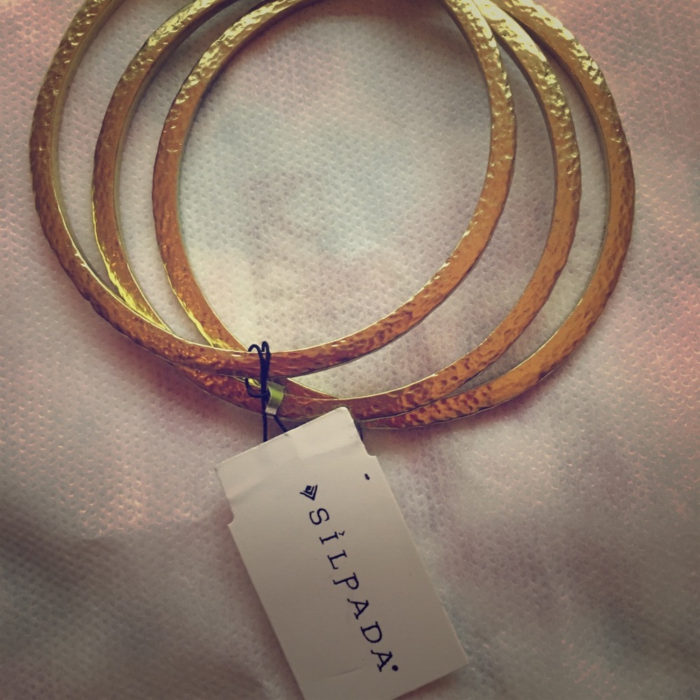 Beautiful hammered gold tone Silpada Bracelets.